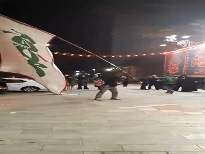 اهتزاز پرچم یا فاطمه الزهرا(س) در باغ ملی مشهد